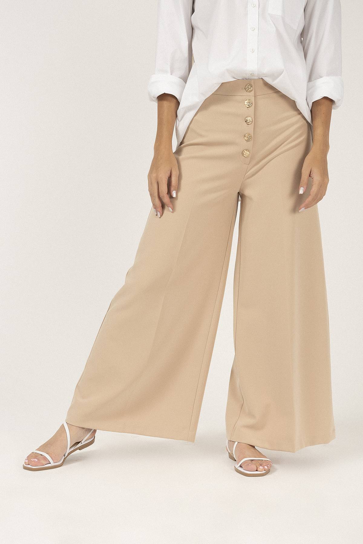 Cristy Boutique  Pantalones palazzo en color beige y un hermoso